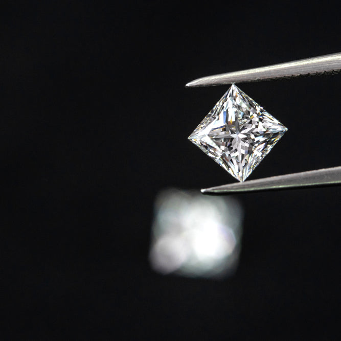Close Up of Tweezer Holding a Lab Diamond