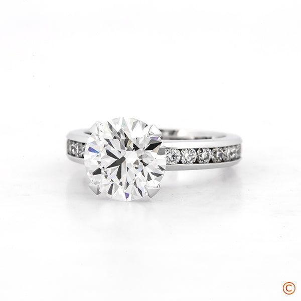 Custom Platinum Channel Set with 4 prong style head featuring our  Signature Diamonds