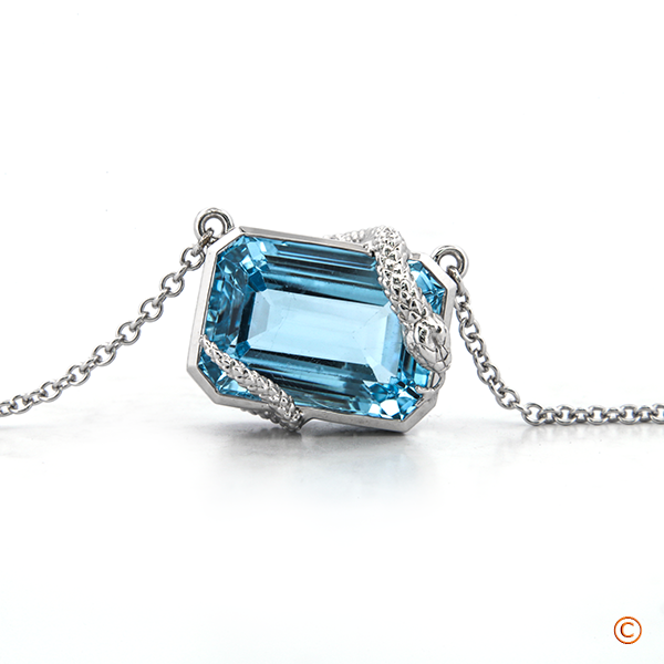 Custom Emerald Shaped Aquamarine Bezel Set Pendant Featuring A Snake Wrap