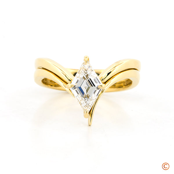 Twist "tension-like" design with Lozenge Step Cut Center Stone and Matching Wrapped Wedding Band