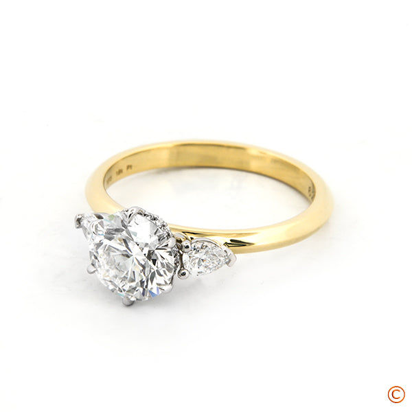 Custom Three Stone Ring Setting featuring Pears and a Six Prong Platinum Head Accented with an Invisible Halo