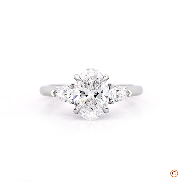 Three Stone Trellis Style Engagement Ring featuring Pear Sides