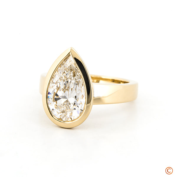 Custom Pear Shape Bezel Diamond Solitaire Ring