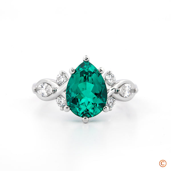 Lab Created Green Emerald set into a Custom Twisted/Wrapped Style Engagement Ring