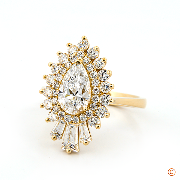 Pear-Shaped Diamond Ring with Round and Tapered Baguette Diamond Halo