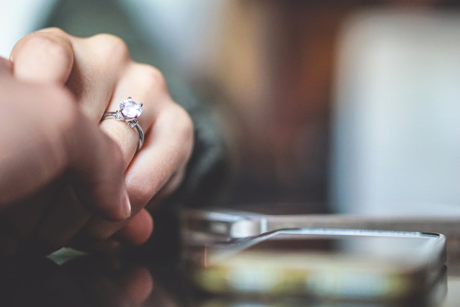 Man Holding the Hand of a Woman Who Is Wearing a Lab Diamond Engagement Ring