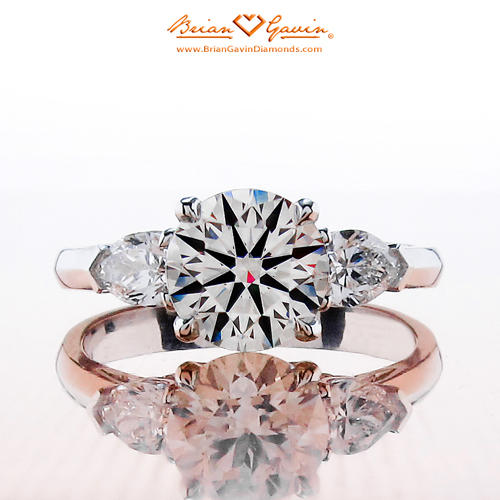 the Summer 3 stone setting by Brian Gavin, which features two pear shape accent diamonds that are set nice and low on the ring shank
