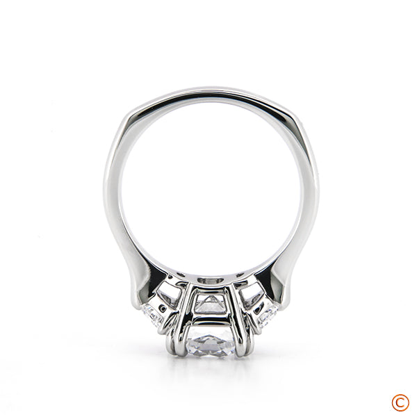 Custom Three Stone Setting featuring a 2.50ct Cushion and Half Moon Sides