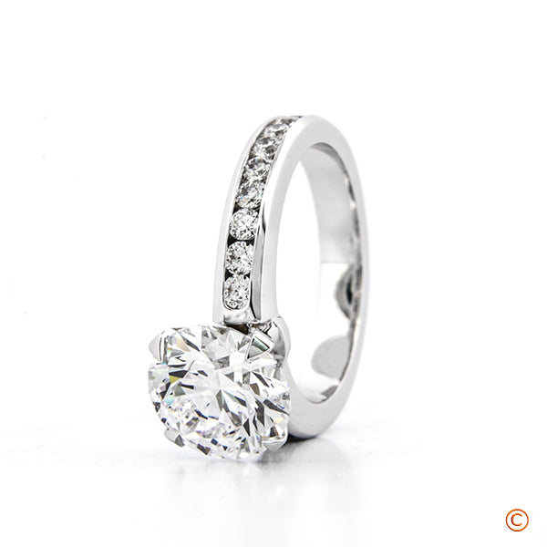 Custom Platinum Channel Set with 4 prong style head featuring our  Signature Diamonds