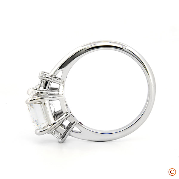 3Stone Ring featuring a 3ct Emerald Cut with Trapezoid Sides