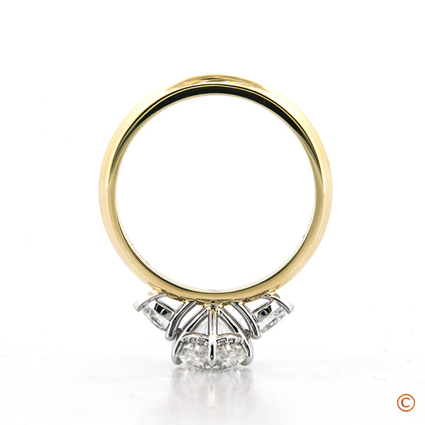 Custom Three Stone Ring Setting featuring Pears and a Six Prong Platinum Head Accented with an Invisible Halo