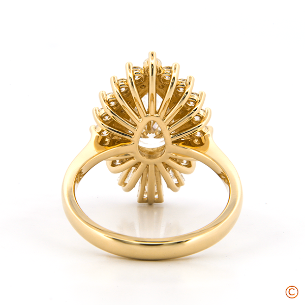 Pear-Shaped Diamond Ring with Round and Tapered Baguette Diamond Halo