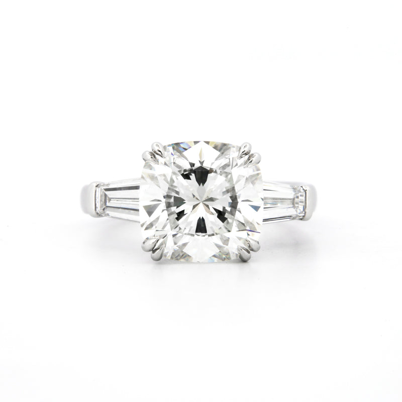 Custom Setting featuring tapered baguettes and a delicate halo