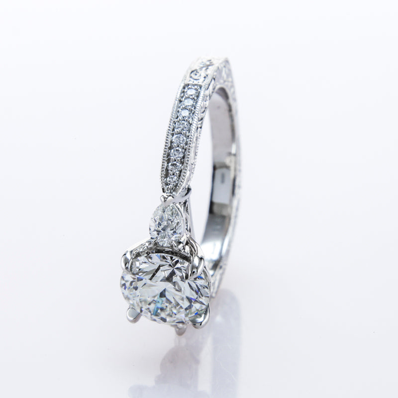 Custom 3 Stone Diamond Ring featuring Pear Shaped Side Stones and Hand Engraving